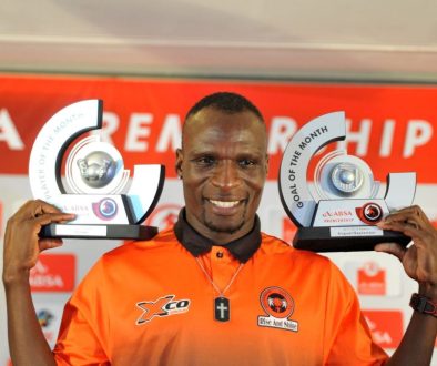 Former Polokwane City and Mamelodi Sundowns striker Rodney Ramagalela holding Absa Premiership goal of the moth and player of the month trophies.